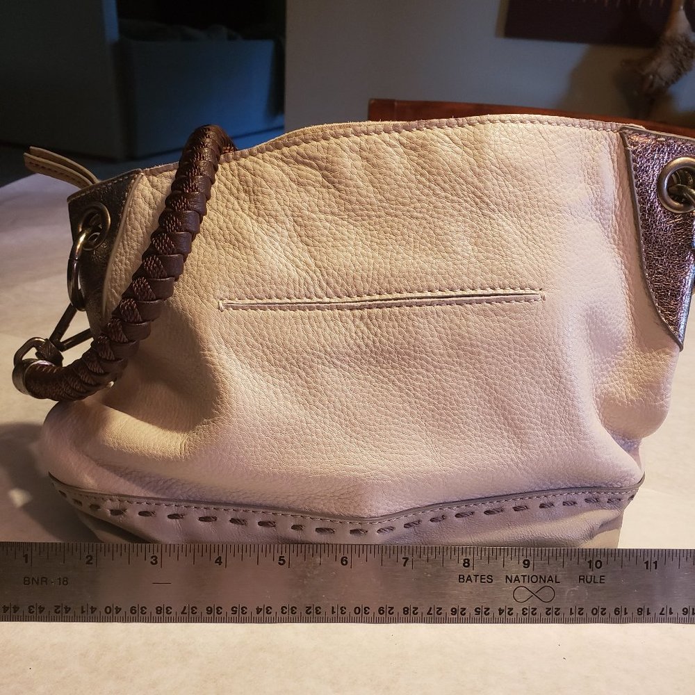 The Sak leather shoulder bag in very light gray with pewter and grey accents